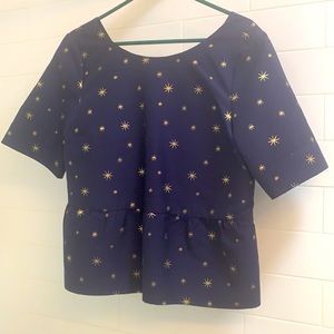 Navy blue shirt with gold stars